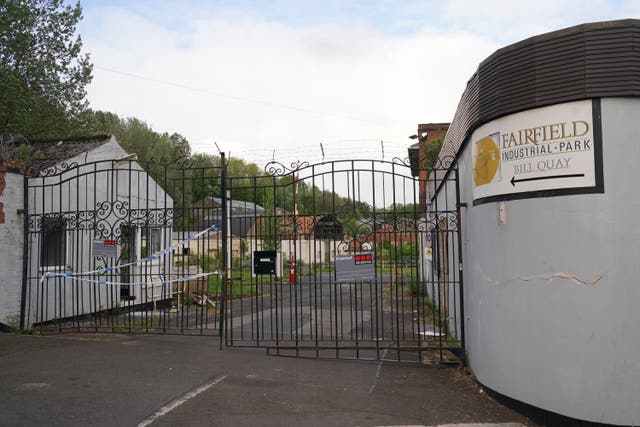 Police tape on the gates of Fairfield Industrial Park