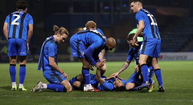 Gillingham's Elliott List (on ground) knocked out Premier League Cardiff 