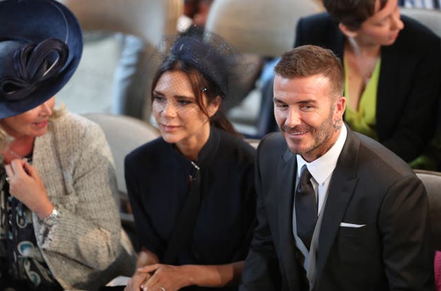 David and Victoria Beckham take their seats in St George’s Chapel (Danny Lawson/PA)