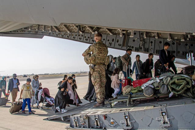 British nationals board a RAF aircraft at Kabul airport 
