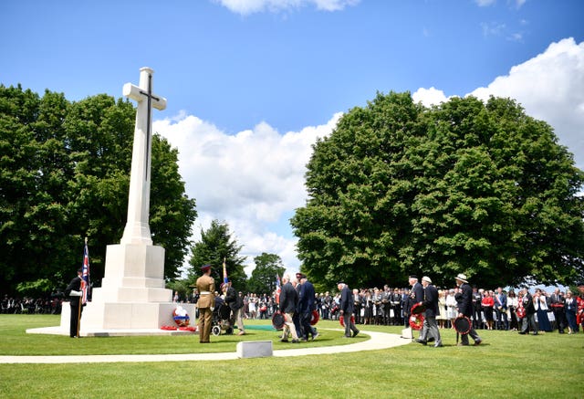 Veterans lay wreaths at the Commonwealth War Graves Commission Cemetery in Bayeux