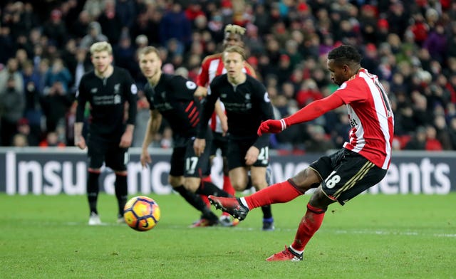 Jermain Defoe, right, scores a Sunderland penalty against Liverpool