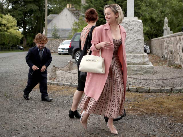 Actors Peter Dinklage and Emilia Clarke on their way to the wedding (Jane Barlow/PA)