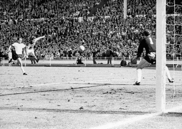 Sir Geoff Hurst fires home his hat-trick goal in the 1966 World Cup final