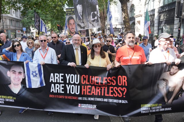 Chief Rabbi Sir Ephraim Mirvis (centre left) joins family members of hostages being held by Palestinian militant group Hamas, Jewish community leaders and antisemitism campaigners take part in the National March For The Hostages in central London