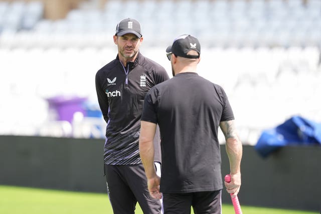 James Anderson, left, with England head coach Brendon McCullum
