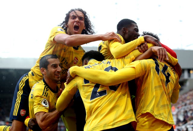 Pierre-Emerick Aubameyang celebrates scoring at St James'' Park