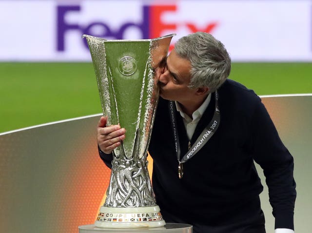 Mourinho kisses the trophy after winning the UEFA Europa League Final against Ajax in May 2017