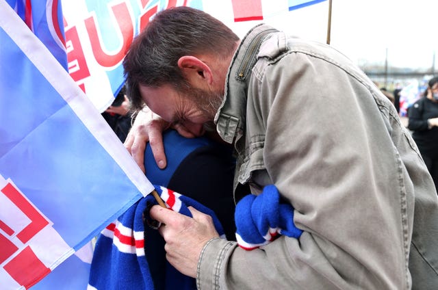 Fans embrace outside Ibrox