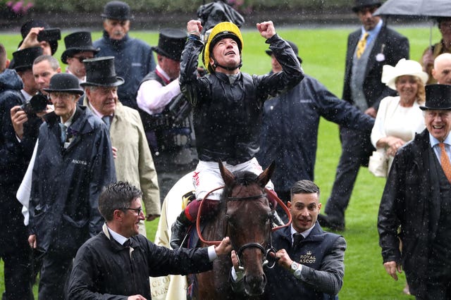 Sir Michael Stoute (light mac) follows Crystal Ocean back