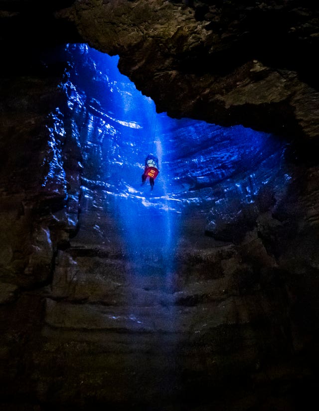 A potholer is winched into Gaping Gill (Danny Lawson/PA)