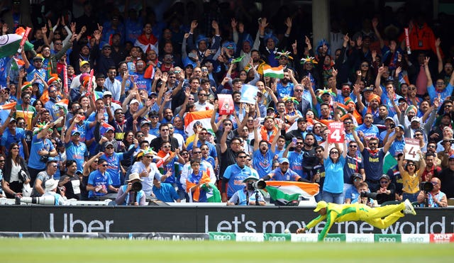 India fans celebrate as their side score another boundary at the Oval