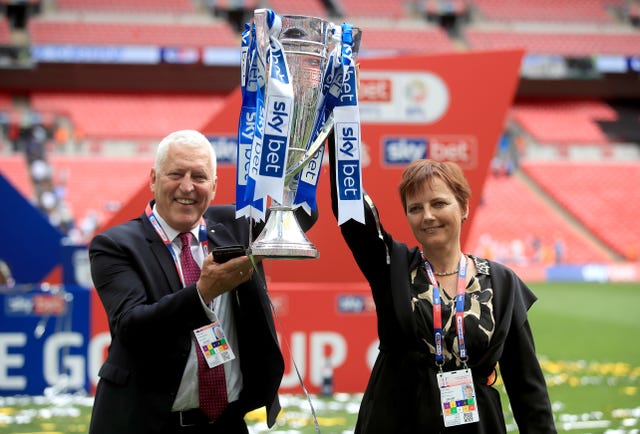 Mark Palios and Nicola Palios celebrate winning the Sky Bet League Two play-off final last year