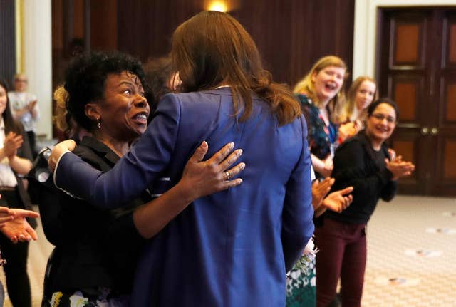 The Duchess of Cambridge is greeted by Professor Jacqueline Dunkley-Bent, who helped deliver of one of her children (Peter Nicholls/PA)