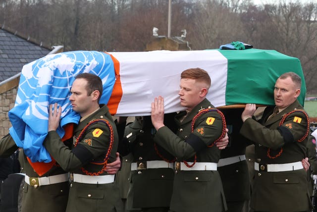 Soldiers carrying Private Sean Rooney's coffin