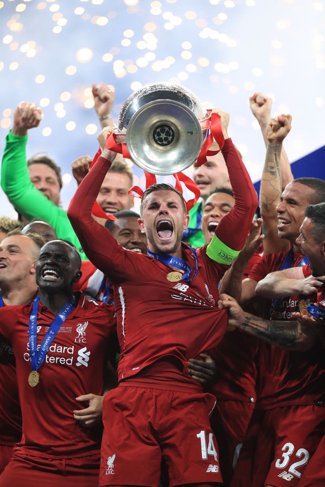 Liverpool captain Jordan Henderson lifts the Champions League trophy after his side shrugged of the disappointment of finishing second in the Premier League to win the club's fifth European cup. Goals from Mohamed Salah and Divock Origi secured a 2-0 success over Tottenham on June 1 at Atletico Madrid's Wanda Metropolitano stadium