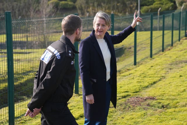 Yvette Cooper speaking to a police officer