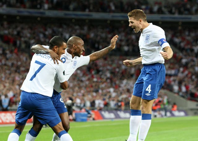 Jermain Defoe (left) celebrates with Steven Gerrard (right) when playing for England. (Steve Parsons/PA Images)