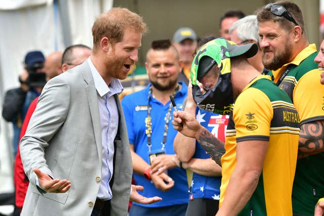 The Duke of Sussex shares a joke with an Australian competitor