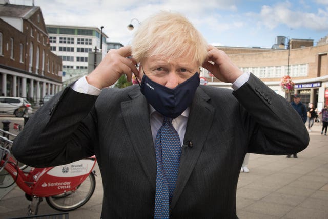 Prime Minister Boris Johnson meets shoppers and shopkeepers during a visit to his constituency in Uxbridge, west London