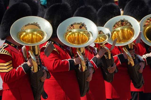 Sun gleams on the brass section of the military band