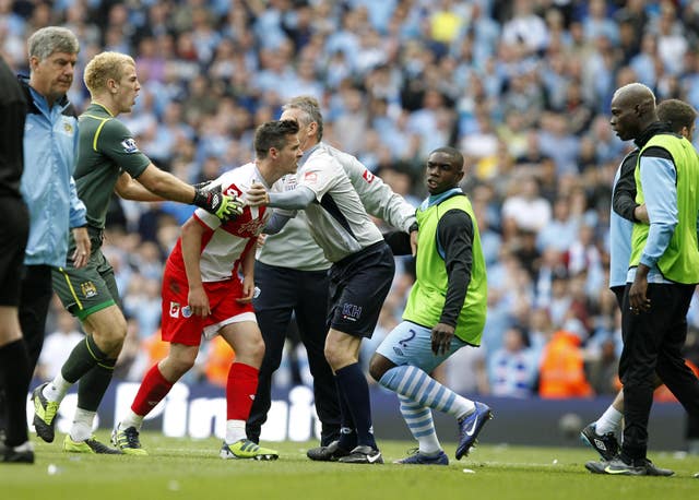 Joey Barton, centre, received a lengthy ban for his reaction to his dismissal playing for QPR at Manchester City