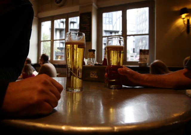 Patrons with their drinks in Irish pub O’Neill’s in Carnaby Street, central London