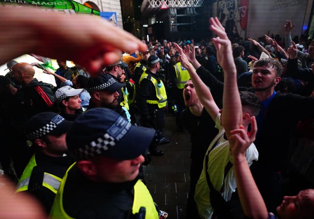 England fans clash with police in Piccadilly Circus, London, after Italy beat England on penalties to win the Euro 2020 final 