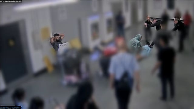 CCTV still of the alleged assault of three police officers at Manchester Airport