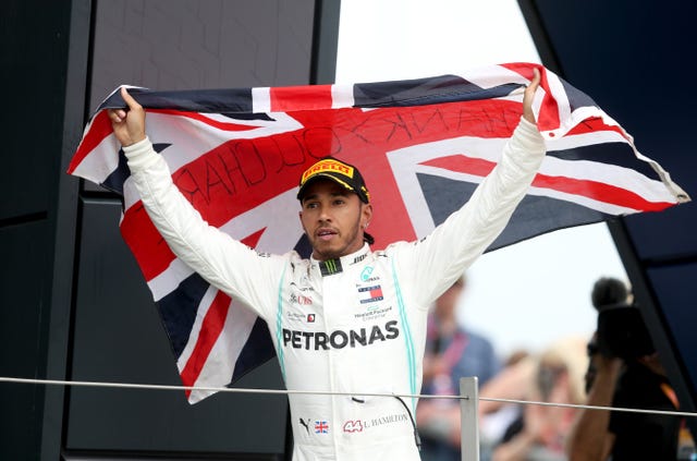 Hamilton celebrates after a victorious 2019 British Grand Prix