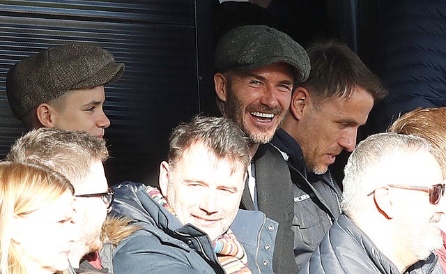 David Beckham, centre, was joined by son Romeo, left, for Salford's game (Martin Rickett/PA)