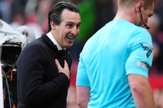 Aston Villa manager Unai Emery, left, speaks to referee Thomas Bramall after the defeat at Old Trafford