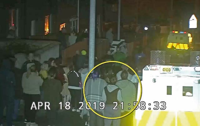CCTV image of Lyra McKee (circled) within the crowd watching a protest in Londonderry before she was shot