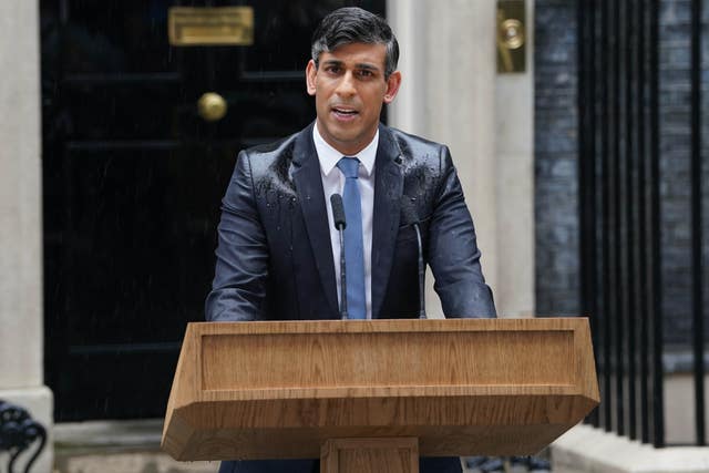 A rain-soaked Rishi Sunak giving a speech outside 10 Downing Street after calling a general election for July 4 2024