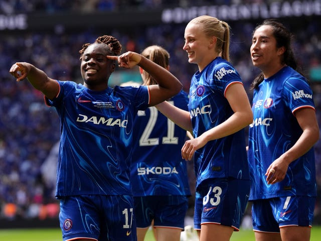 Sandy Baltimore (left) celebrates with team-mates after scoring for Chelsea