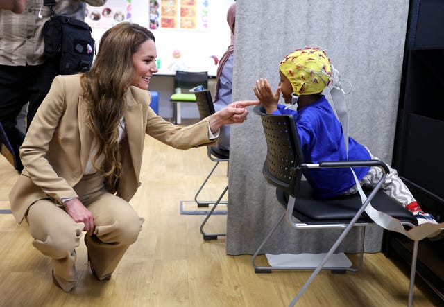Kate chats to Mikail who was taking part in research at the university's Institute for the Science of Early Years and Youth