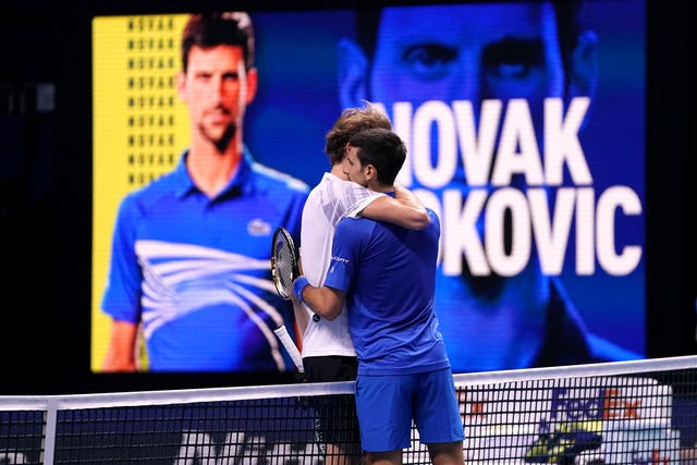Novak Djokovic (right) embraces Alexander Zverev after their clash at The O2