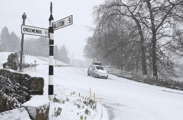 Roads in some areas were closed due to heavy snow (Owen Humphreys/PA)