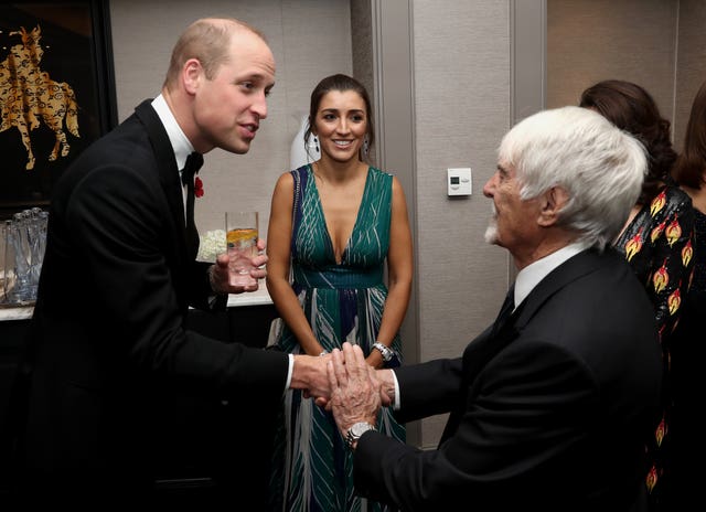 Bernie Ecclestone shaking hands with the Duke of Cambridge earlier this year