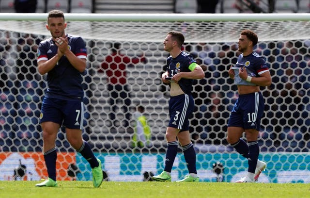 John McGinn (left) and his team-mates reflect on their opening defeat