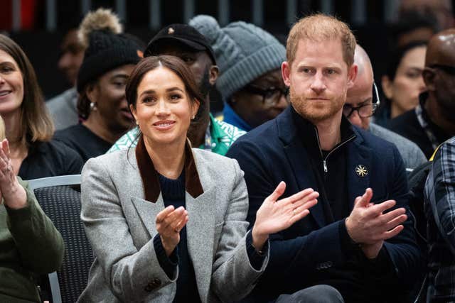 Harry and Meghan watching the Invictus Games