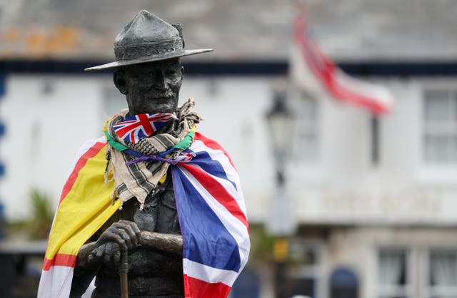 A Dorset flag and a Union flag on the statue (Andrew Matthews/PA)