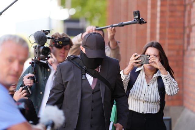 Funeral director Robert Bush (centre) arrives at Hull Crown Court, Kingston-upon-Hull, for sentencing after human remains were found at his premises