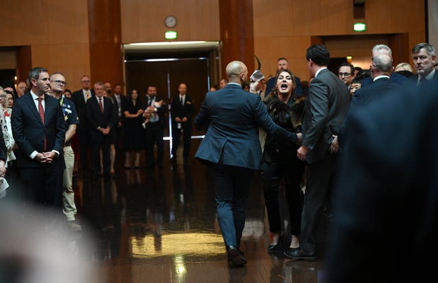 Australian senator Lidia Thorpe protests during the ceremonial welcome to Australia for King Charles and Queen Camilla at Australian Parliament House in Canberra