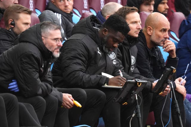 Manchester City manager Pep Guardiola, right, with assistants Kolo Toure, centre, and Pep Lijnders, second right