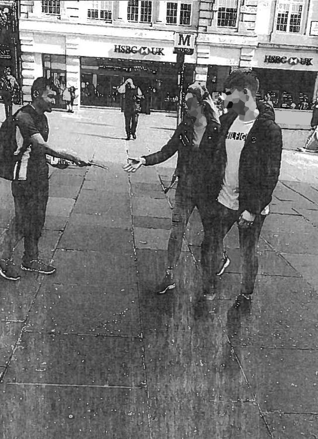 Abdul Ezedi (left) handing out church leaflets in the street