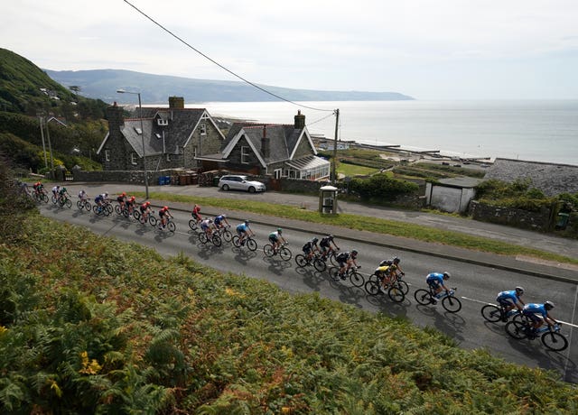 The peloton passes through Barmouth during stage four of the Tour of Britain from Aberaeron to Great Orme, Llandudno.