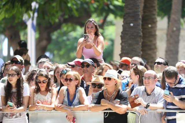 Onlookers await the arrival of the Duke of Cambridge in Tel Aviv