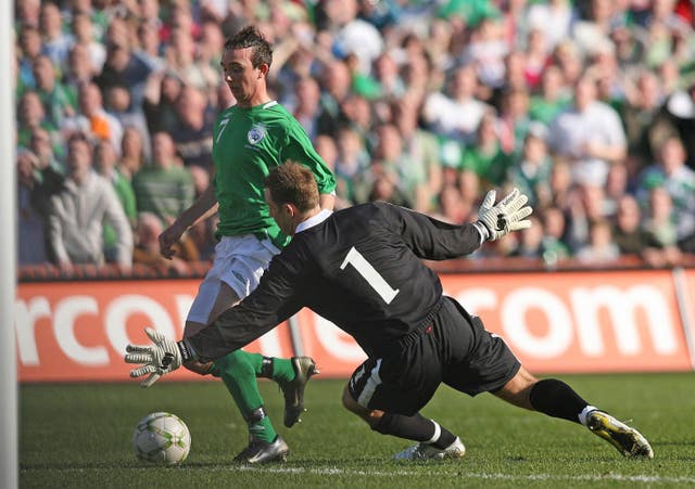Republic of Ireland midfielder Stephen Ireland beats Wales keeper Danny Coyne to score the only goal in a Euro 2008 qualifier in March 2007