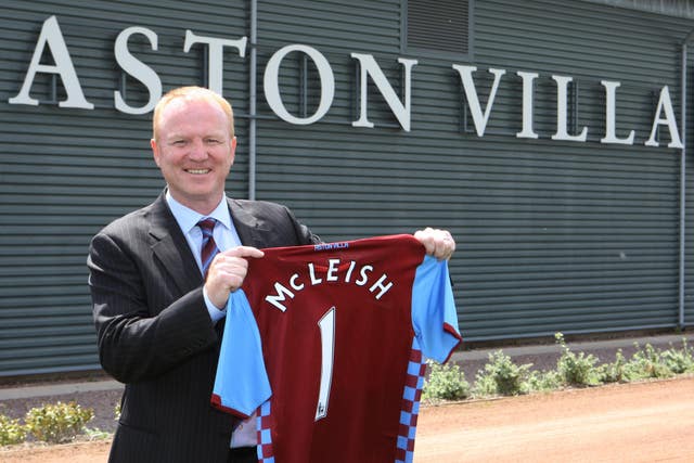 Alex McLeish poses with an Aston Villa shirt